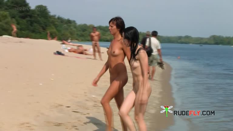 Nude Beach Girl Sunbathes Next To Her Man Outdoors
