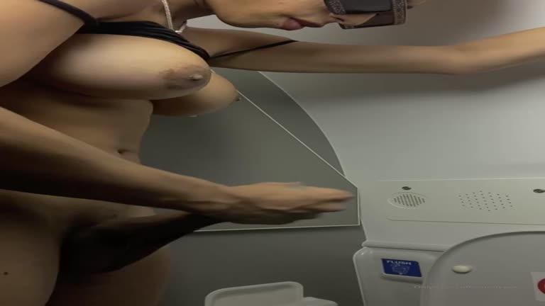 Transvestite Masturbating In The Bathroom Of The Plane