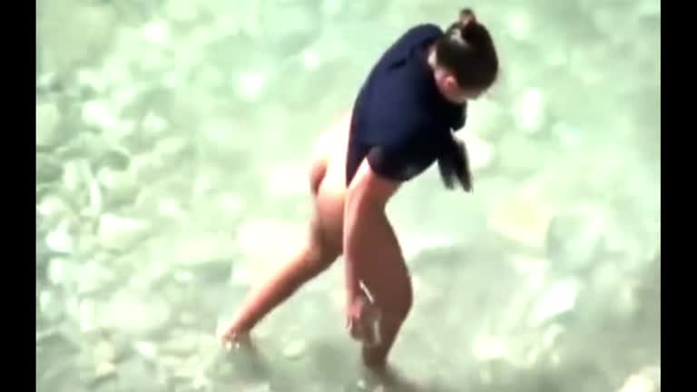 Stepmother Wades Naked In The Surf